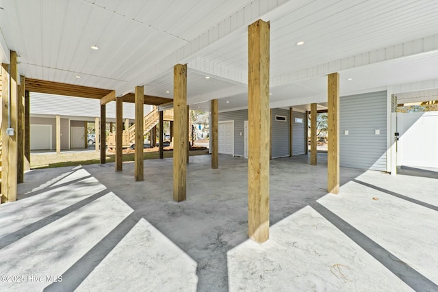 7105 E Yacht Dr, Oak Island, NC 28465 - view of patio featuring stairs and a carport