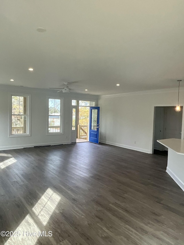 unfurnished living room with a ceiling fan, recessed lighting, dark wood-style floors, and baseboards