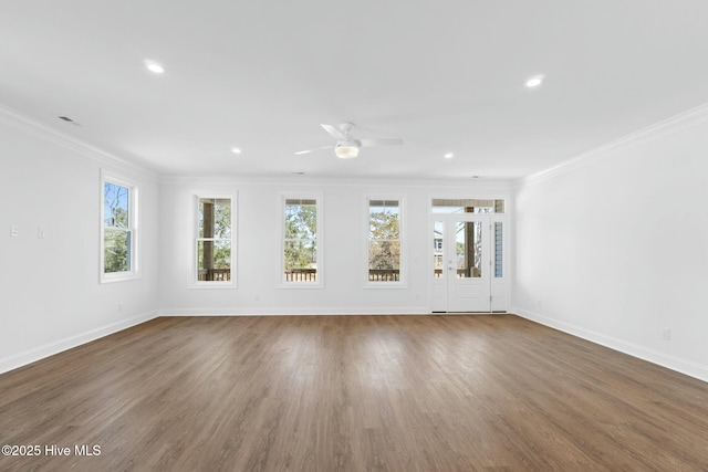 7105 E Yacht Dr, Oak Island, NC 28465 - unfurnished living room with plenty of natural light, crown molding, baseboards, recessed lighting, and ceiling fan