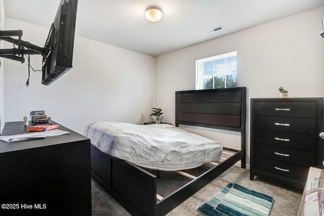 bedroom with carpet flooring and visible vents