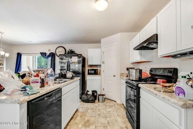 kitchen with a sink, white cabinetry, light countertops, ventilation hood, and black appliances