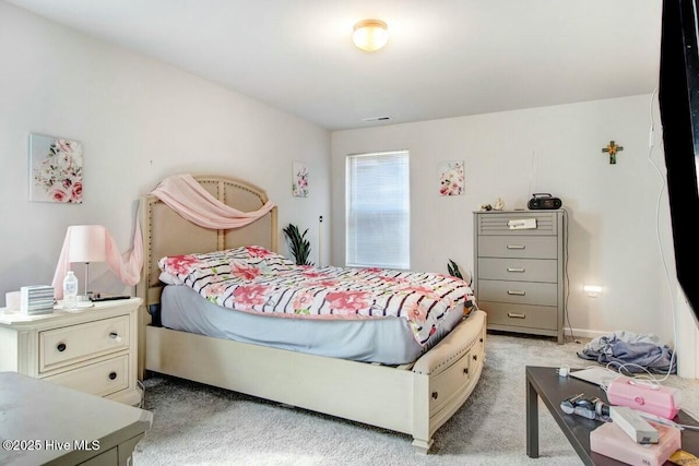 bedroom with light carpet and visible vents