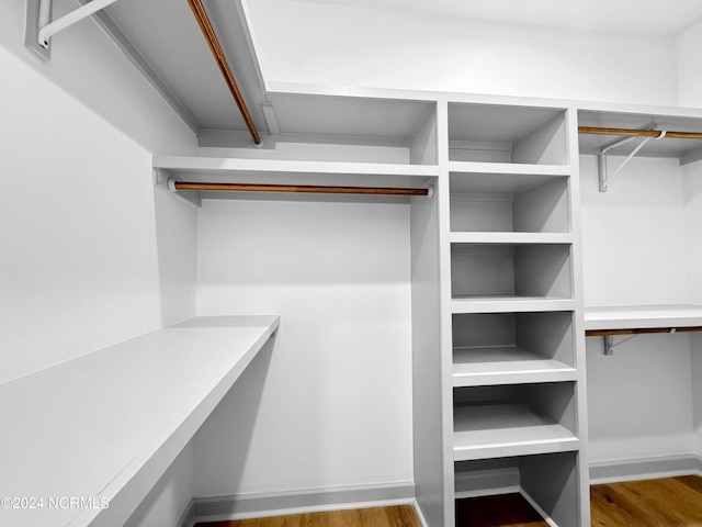 spacious closet featuring wood finished floors