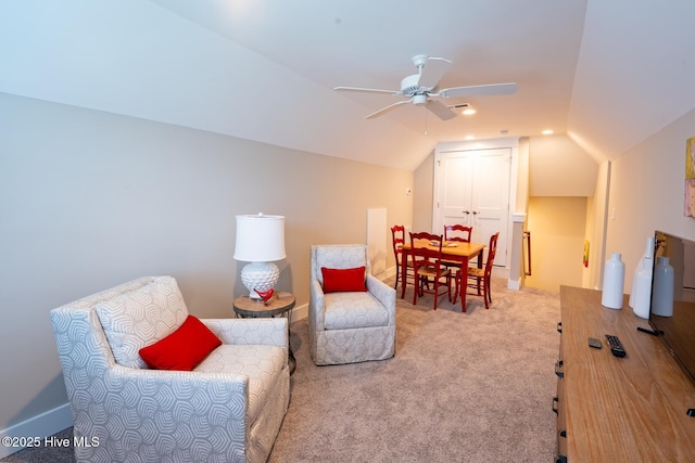 sitting room featuring carpet floors, ceiling fan, and vaulted ceiling