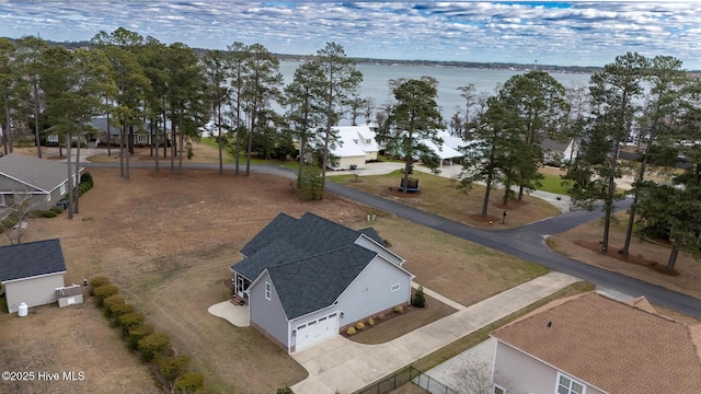 birds eye view of property featuring a water view