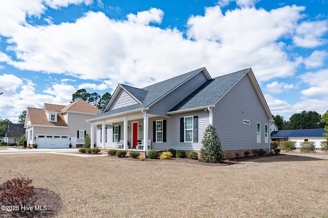 view of front of home featuring a garage and a porch