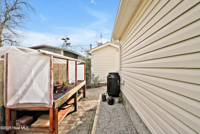 view of patio / terrace with an outbuilding and an exterior structure