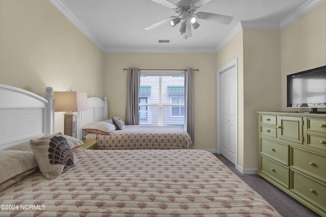 bedroom with ceiling fan, visible vents, baseboards, ornamental molding, and dark colored carpet