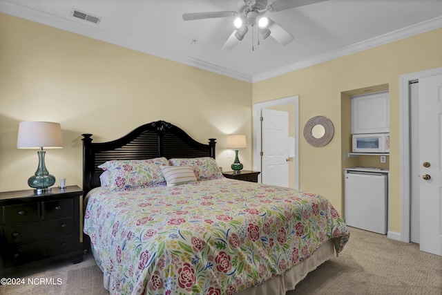 bedroom with carpet floors, crown molding, visible vents, a ceiling fan, and fridge