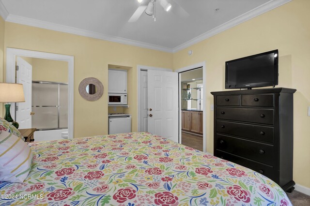 carpeted bedroom with ceiling fan, ornamental molding, connected bathroom, and baseboards