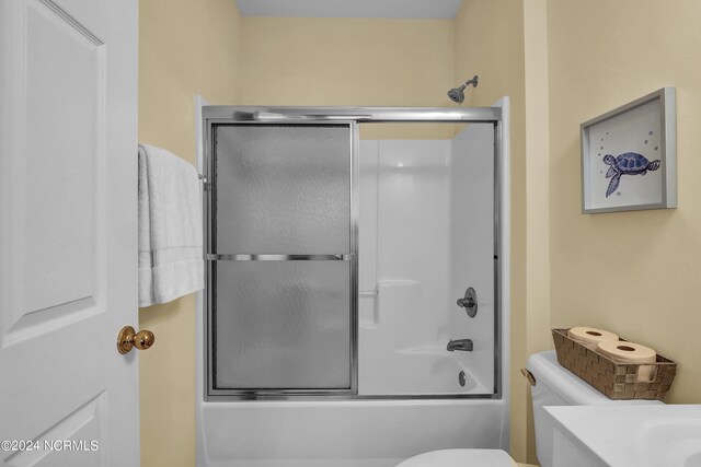 full bathroom with toilet, combined bath / shower with glass door, and vanity