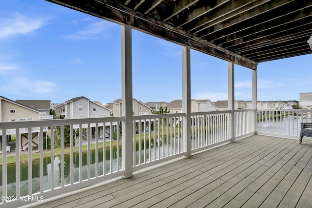 deck featuring a residential view and a water view