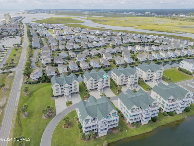 bird's eye view featuring a water view and a residential view