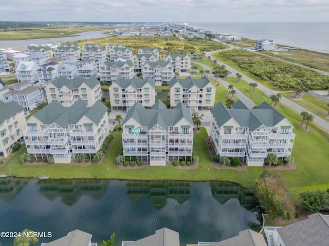 birds eye view of property featuring a residential view and a water view