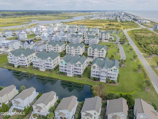 drone / aerial view featuring a water view and a residential view