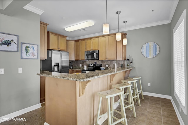 kitchen with tasteful backsplash, appliances with stainless steel finishes, ornamental molding, a peninsula, and tile patterned flooring