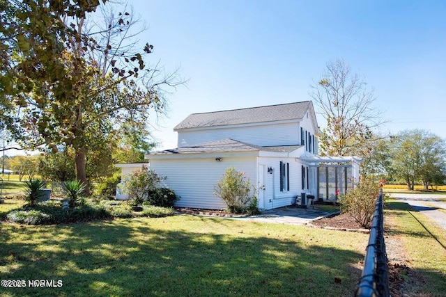 view of home's exterior featuring a patio area, a pergola, and a lawn