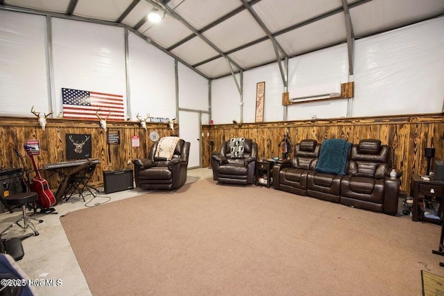 interior space with a garage, wood walls, a wall unit AC, and lofted ceiling