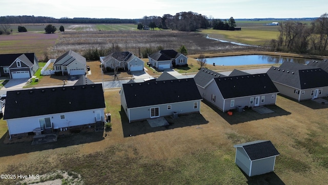 drone / aerial view with a water view and a rural view