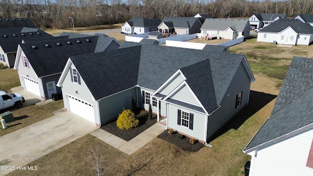 birds eye view of property with a residential view