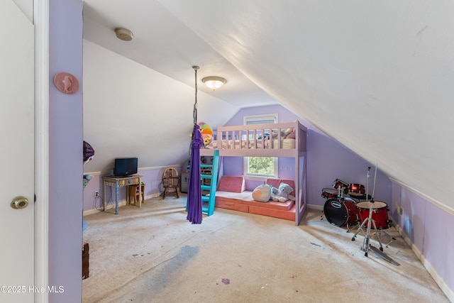 bedroom featuring baseboards, carpet, and lofted ceiling