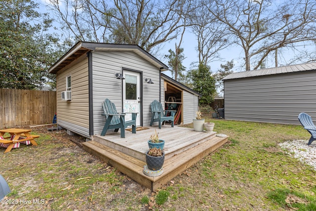 exterior space featuring an outbuilding and fence