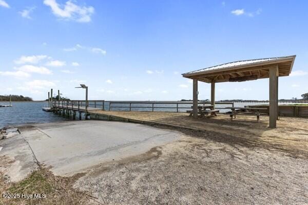 dock area featuring a gazebo and a water view