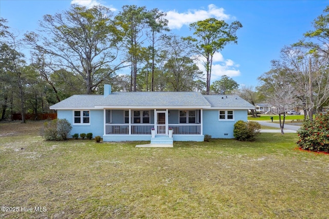 view of front of property with crawl space, covered porch, a chimney, and a front lawn