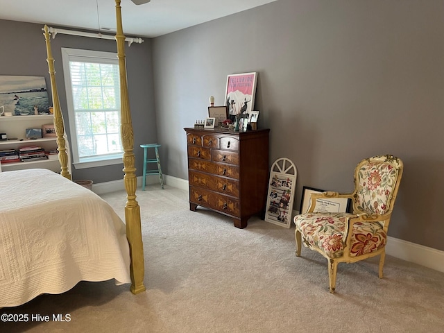 carpeted bedroom featuring baseboards