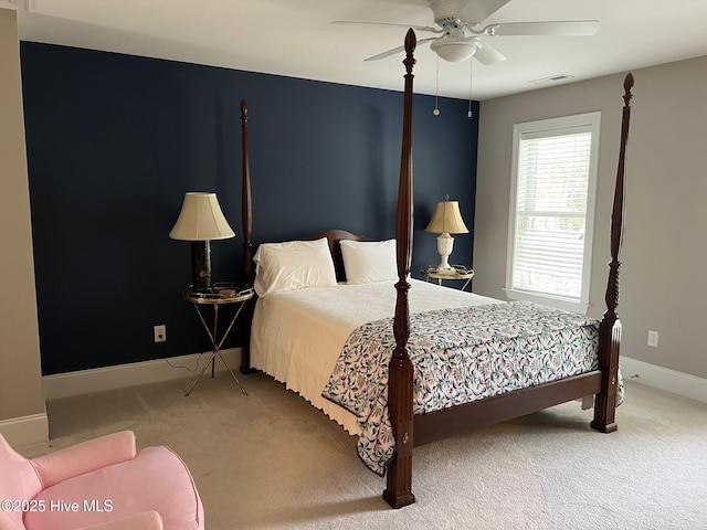 bedroom featuring visible vents, baseboards, ceiling fan, and carpet flooring