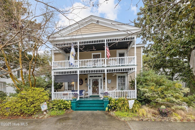 view of front of house featuring a porch and a balcony