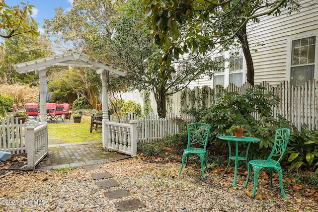 view of yard featuring a patio and fence