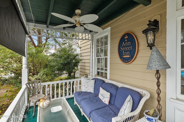 deck featuring a porch and ceiling fan