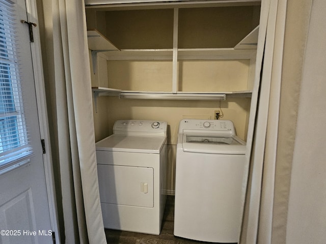 washroom featuring laundry area and washing machine and dryer