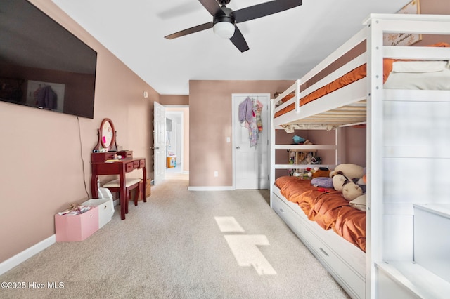 bedroom with ceiling fan and baseboards