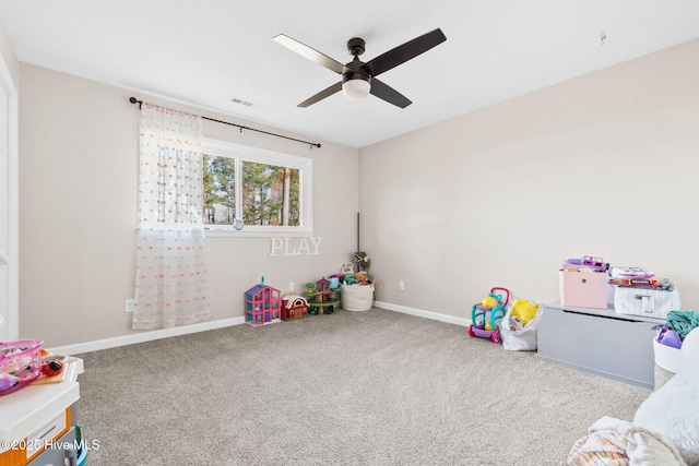 playroom with carpet floors, visible vents, baseboards, and a ceiling fan