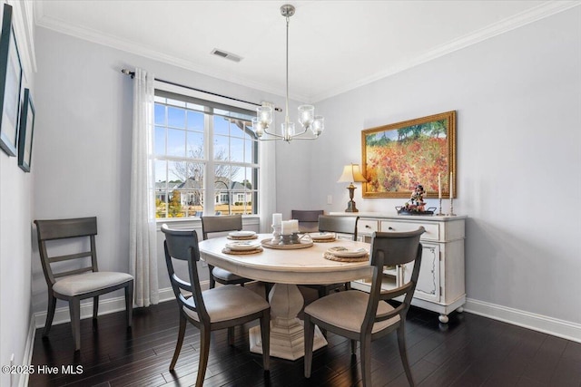 dining space featuring dark wood-style floors, visible vents, crown molding, and baseboards