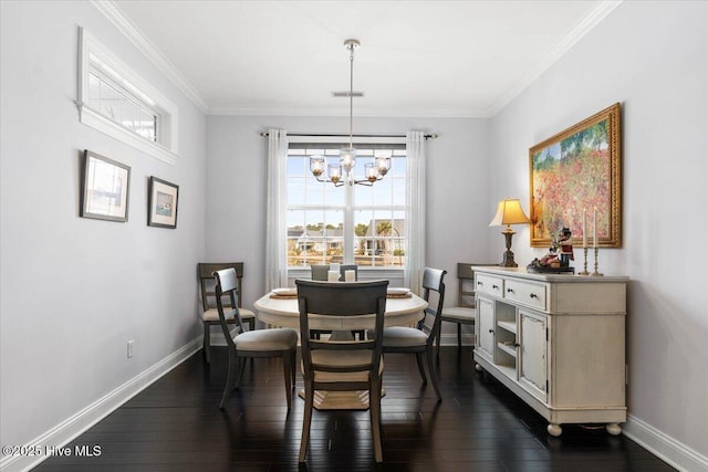 dining area featuring ornamental molding, dark wood-style flooring, and baseboards