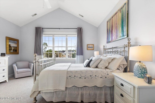 bedroom with light carpet, lofted ceiling, and visible vents