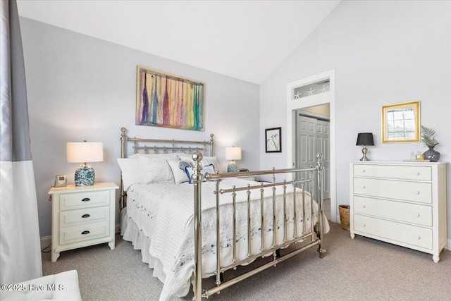 bedroom featuring vaulted ceiling and carpet flooring