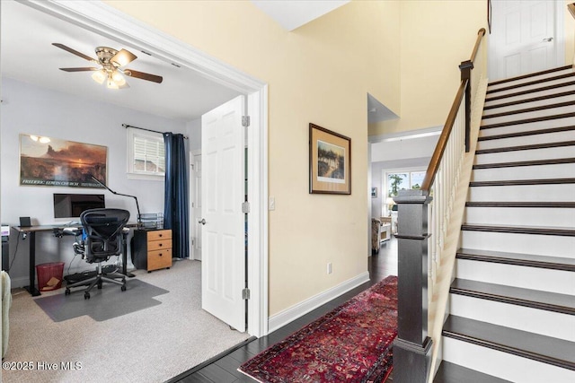 office with ceiling fan, baseboards, and wood finished floors