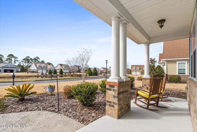 view of patio / terrace featuring a porch and a residential view