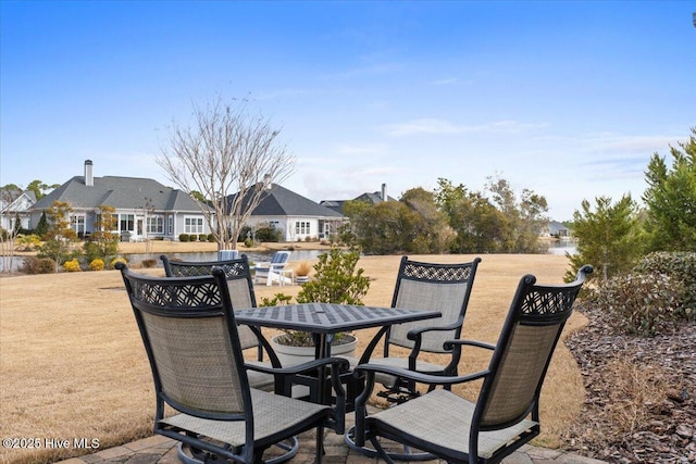 view of patio with outdoor dining space and a residential view