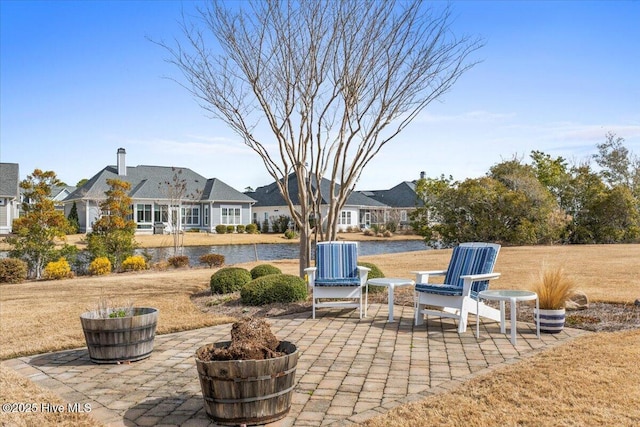 view of patio with a water view