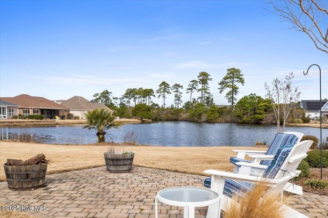 view of patio featuring a water view