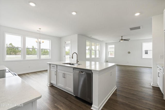 kitchen with dark wood-style floors, visible vents, a sink, light countertops, and dishwasher