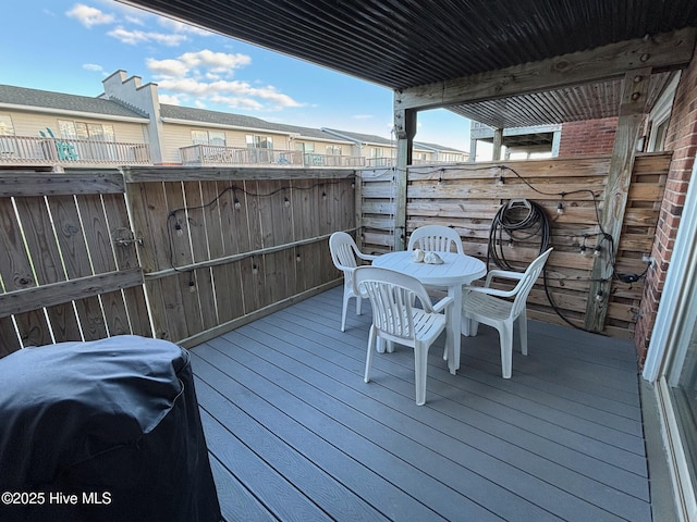 wooden terrace featuring fence and grilling area