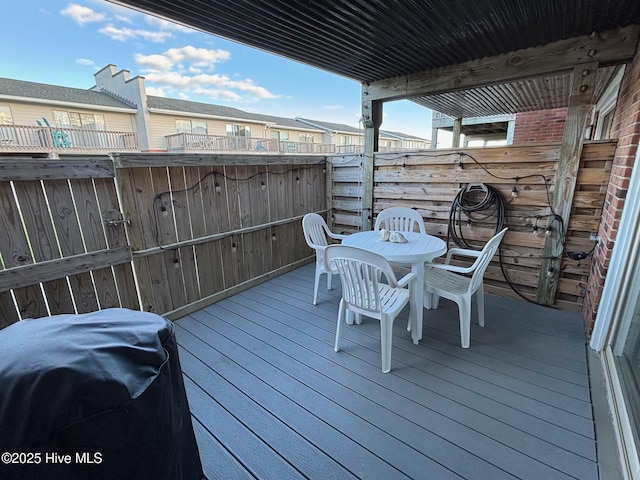 277 Salter Path Rd Unit 79, Pine Knoll Shores, NC 28512 - deck with grilling area, fence, and outdoor dining area