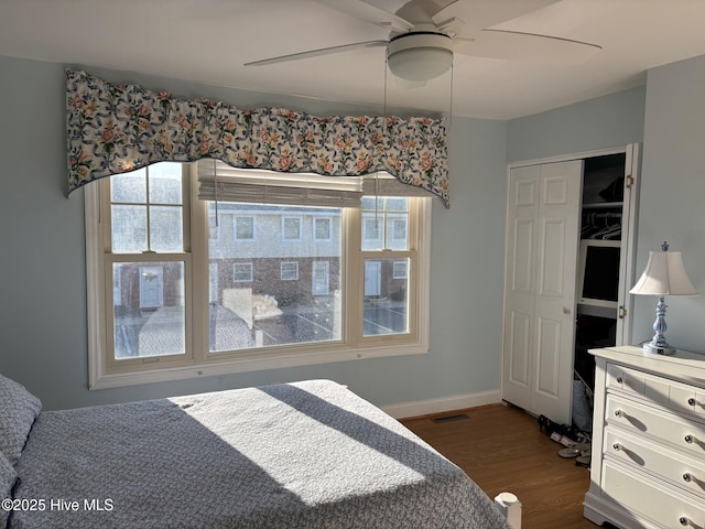 277 Salter Path Rd Unit 79, Pine Knoll Shores, NC 28512 - bedroom with dark wood-style flooring, visible vents, baseboards, and a ceiling fan
