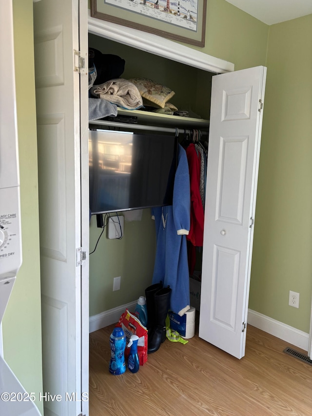 277 Salter Path Rd Unit 79, Pine Knoll Shores, NC 28512 - bedroom with dark wood-style flooring, ceiling fan, washer / dryer, and baseboards